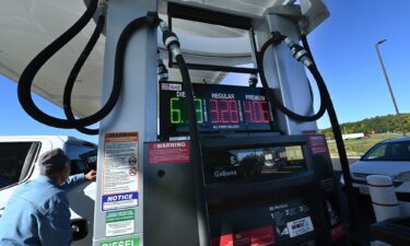 David Rotundo of Blue Mountain Lake fills his pickup truck with gasoline on October 6