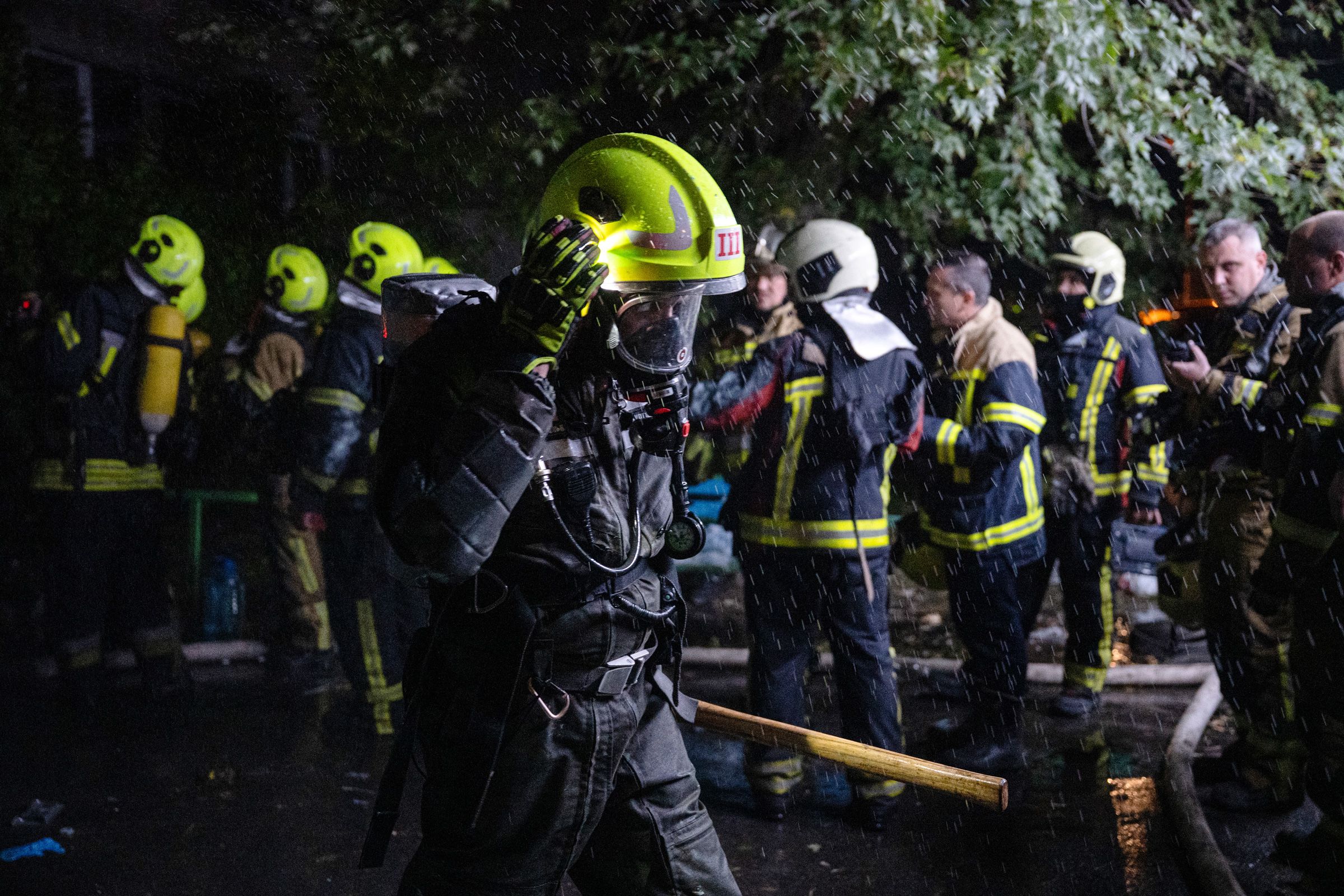 <i>Genya Savilov/AFP/Getty Images via CNN Newsource</i><br/>Ukrainian firefighters extinguish a blaze at the site of a Russian missile strike at an apartment building in Kyiv on Wednesday.