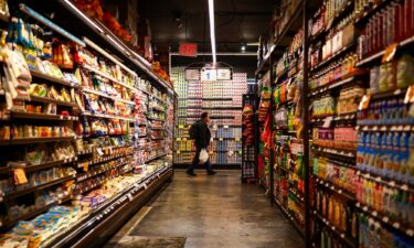 A customer shops in a supermarket in the Sugar Hill neighborhood of Manhattan in New York on September 28.