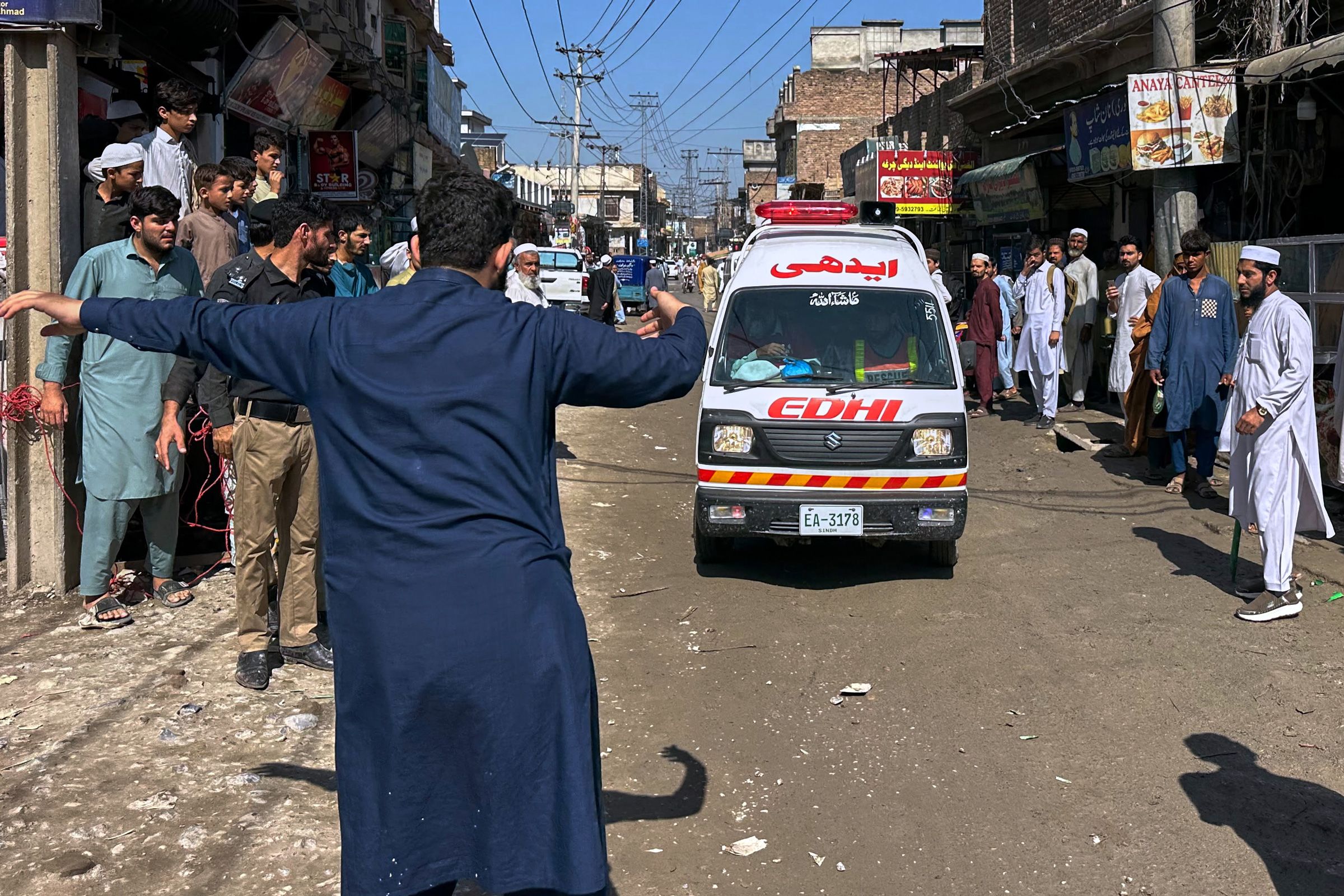 <i>Maaz Awan/AP via CNN Newsource</i><br/>Rescue workers and volunteers take part in the rescue operation at the site of a roof collapse at a private school