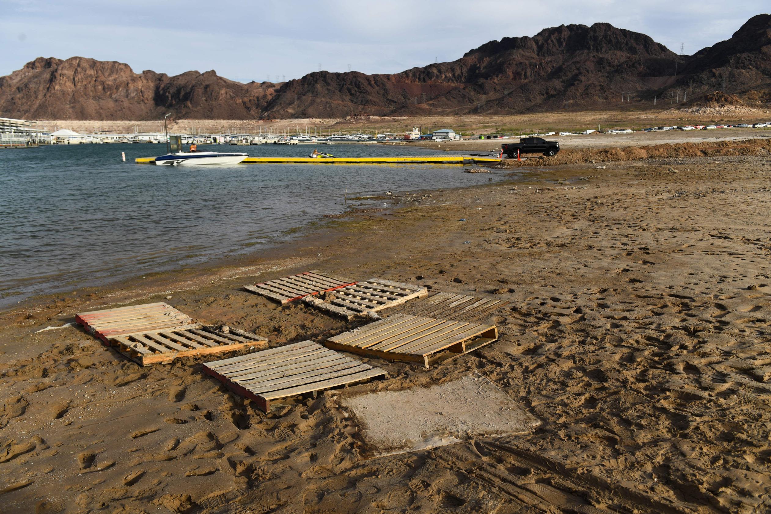 <i>Patrick T. Fallon/AFP/Getty Images/File via CNN Newsource</i><br/>Wooden pallets mark the location where a barrel containing a human body was found