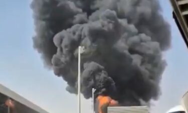 This image from video obtained and verified by AP shows thick black smoke and flames rising from a fire at King Khalid International Airport in Riyadh
