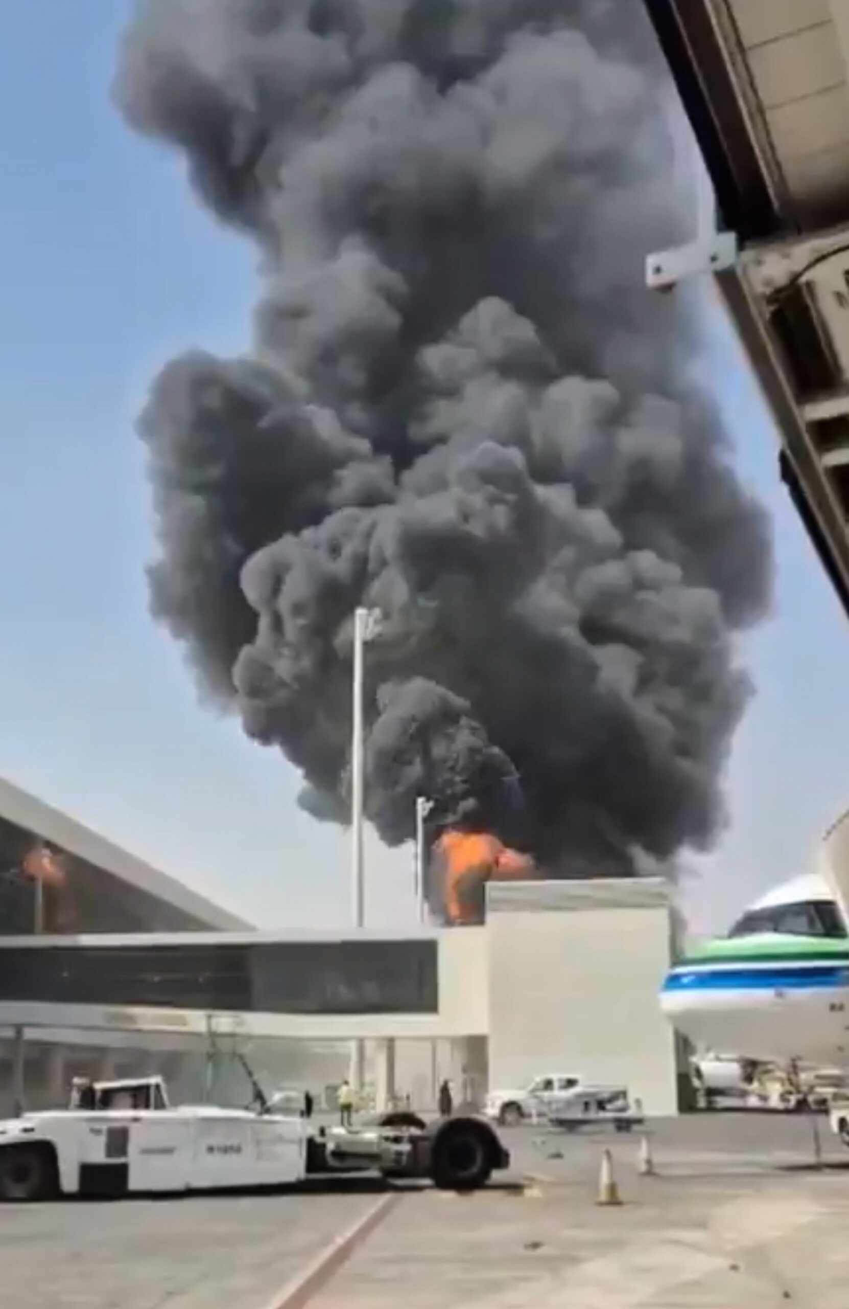 <i>UGC/AP via CNN Newsource</i><br/>This image from video obtained and verified by AP shows thick black smoke and flames rising from a fire at King Khalid International Airport in Riyadh