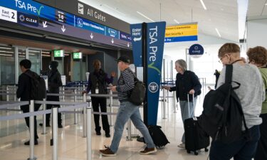 Travelers arrive at the Transportation Security Administration TSA Precheck security line at Denver International Airport (DEN) in Denver