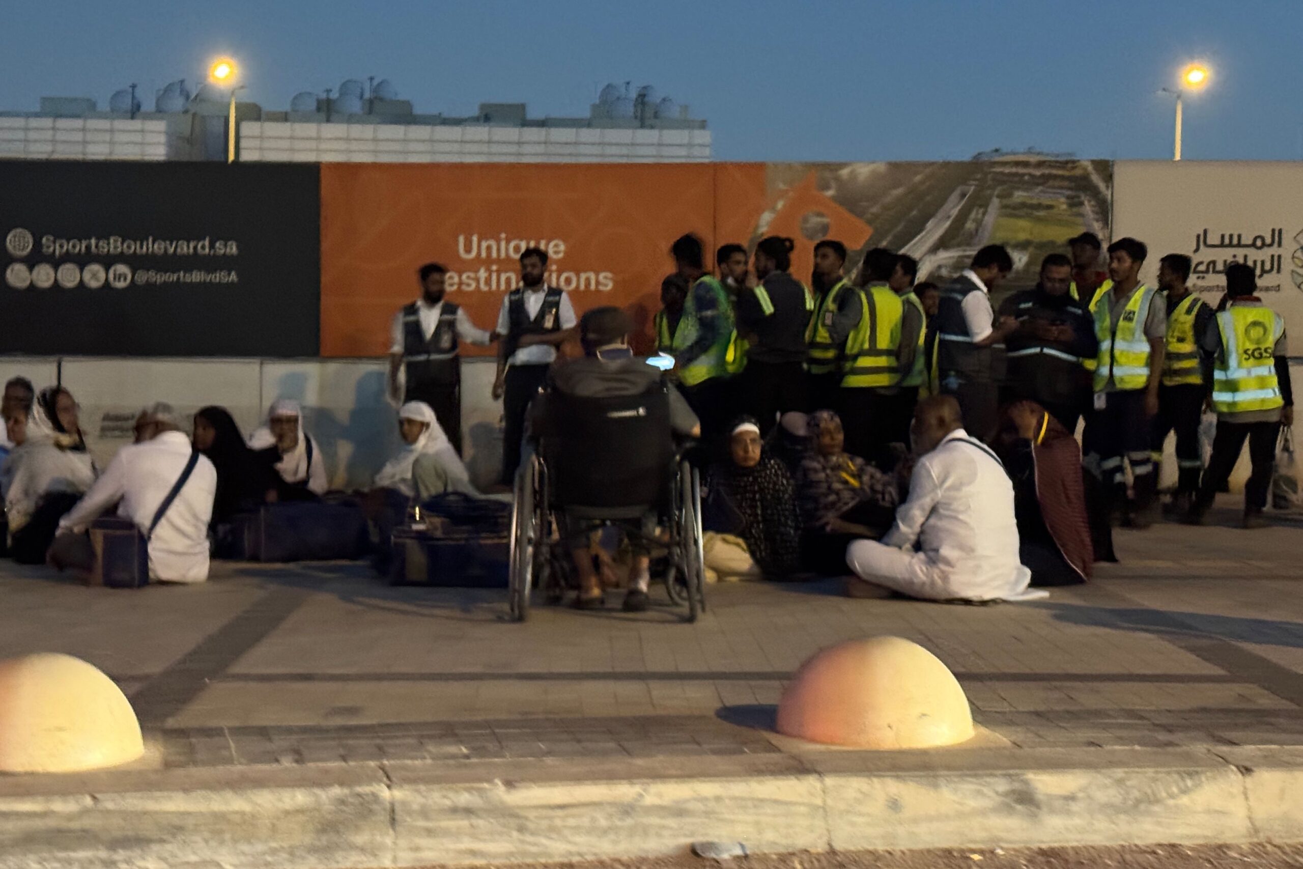 <i>AP via CNN Newsource</i><br/>People gather outside a metro station on the road to King Khalid International Airport in Riyadh