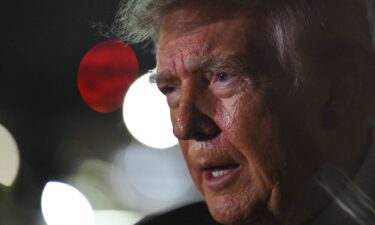 US President Donald Trump speaks to members of the press after landing on October 10 at Joint Base Andrews