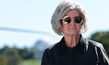 White House chief of staff Susie Wiles looks on as President Donald Trump speaks to the media on the South Lawn of the White House