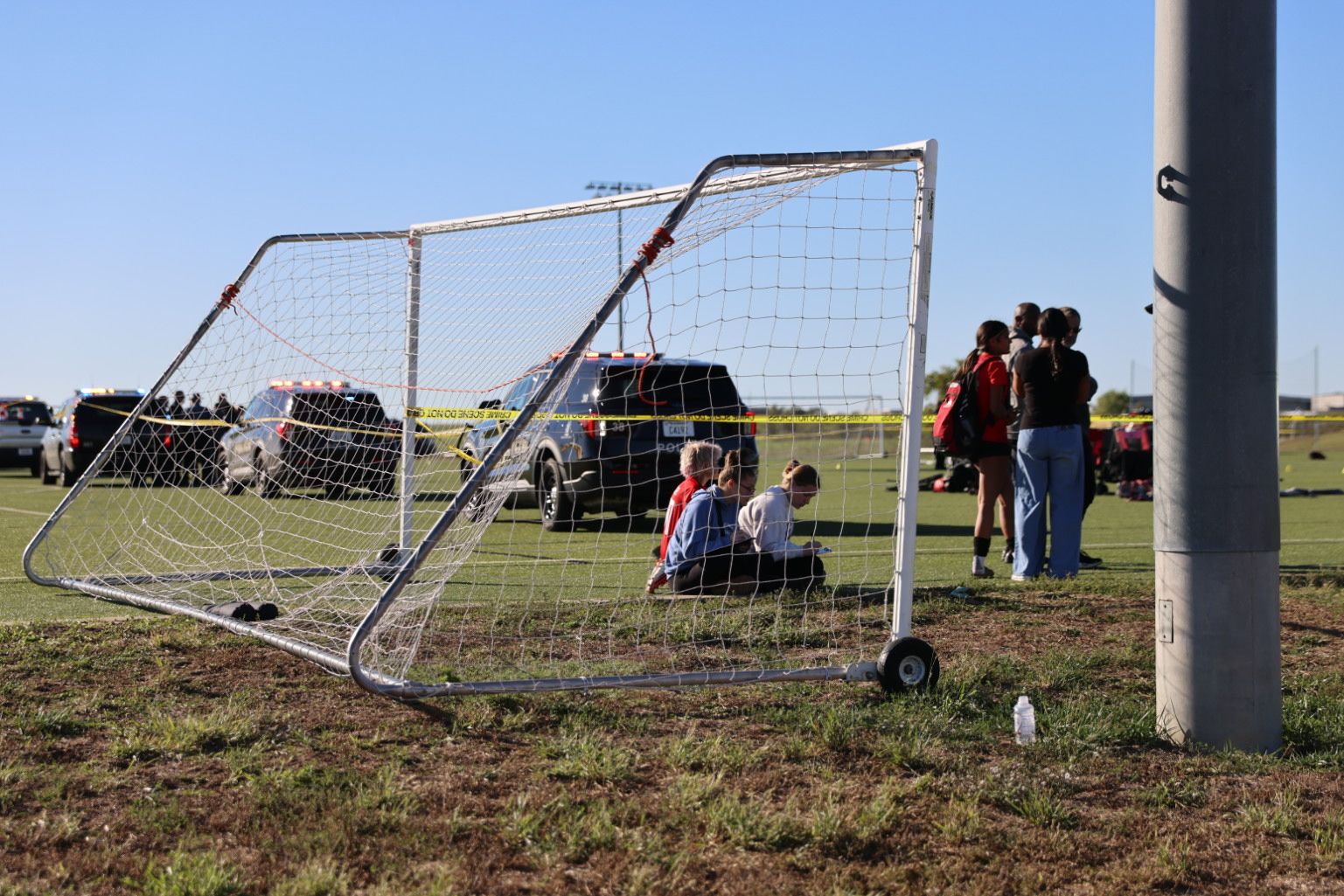 This image provided by KAKE shows police on the scene where a person drove a vehicle through a soccer field during a game in Wichita, Kansas, on Oct. 17, 2026.