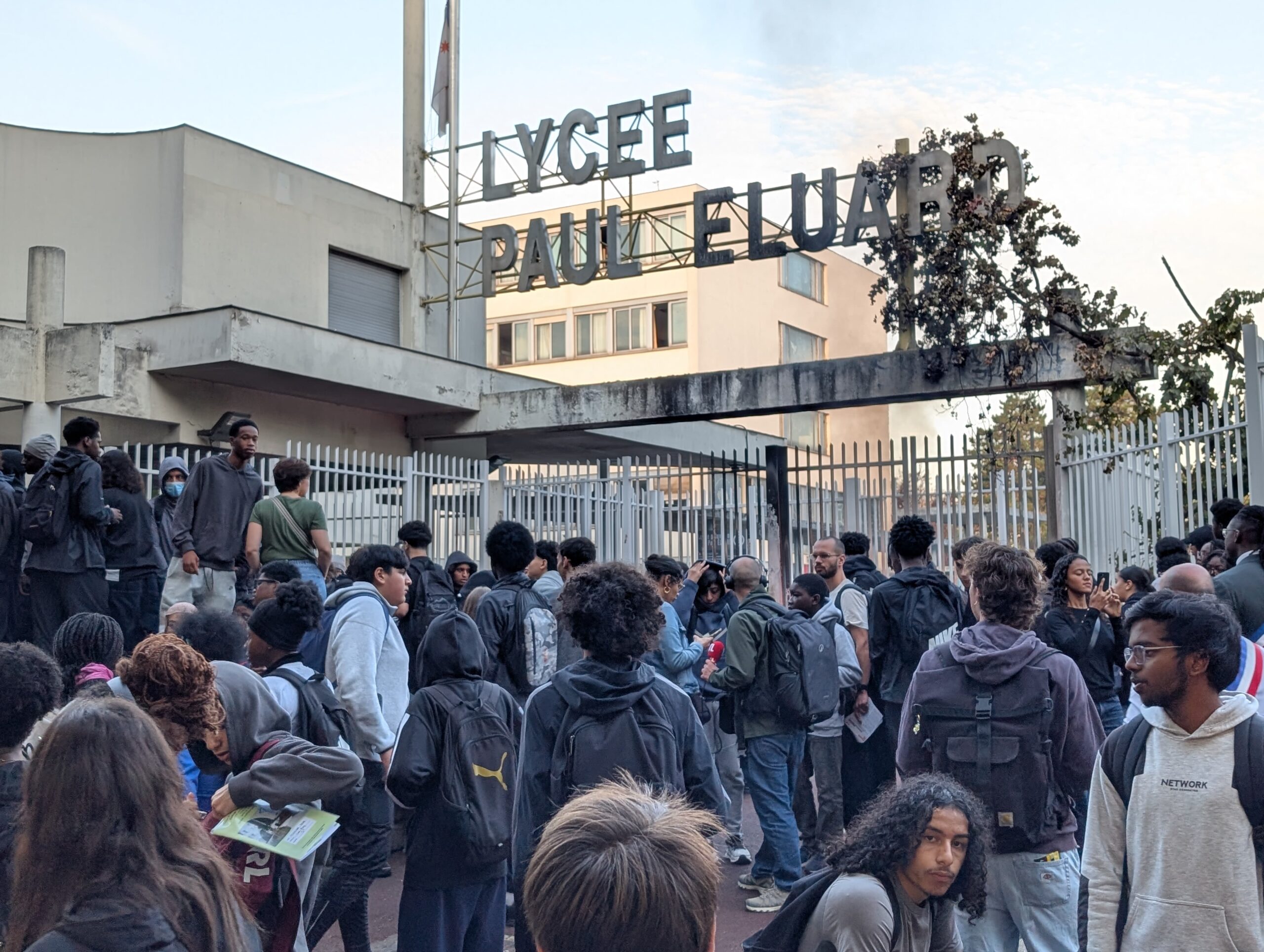 <i>Luc Auffret/Anadolu/Getty Images via CNN Newsource</i><br/>Students gather in front of barricaded gates at the Lycee Paul-Eluard high school in the northern Paris suburb of Saint-Denis