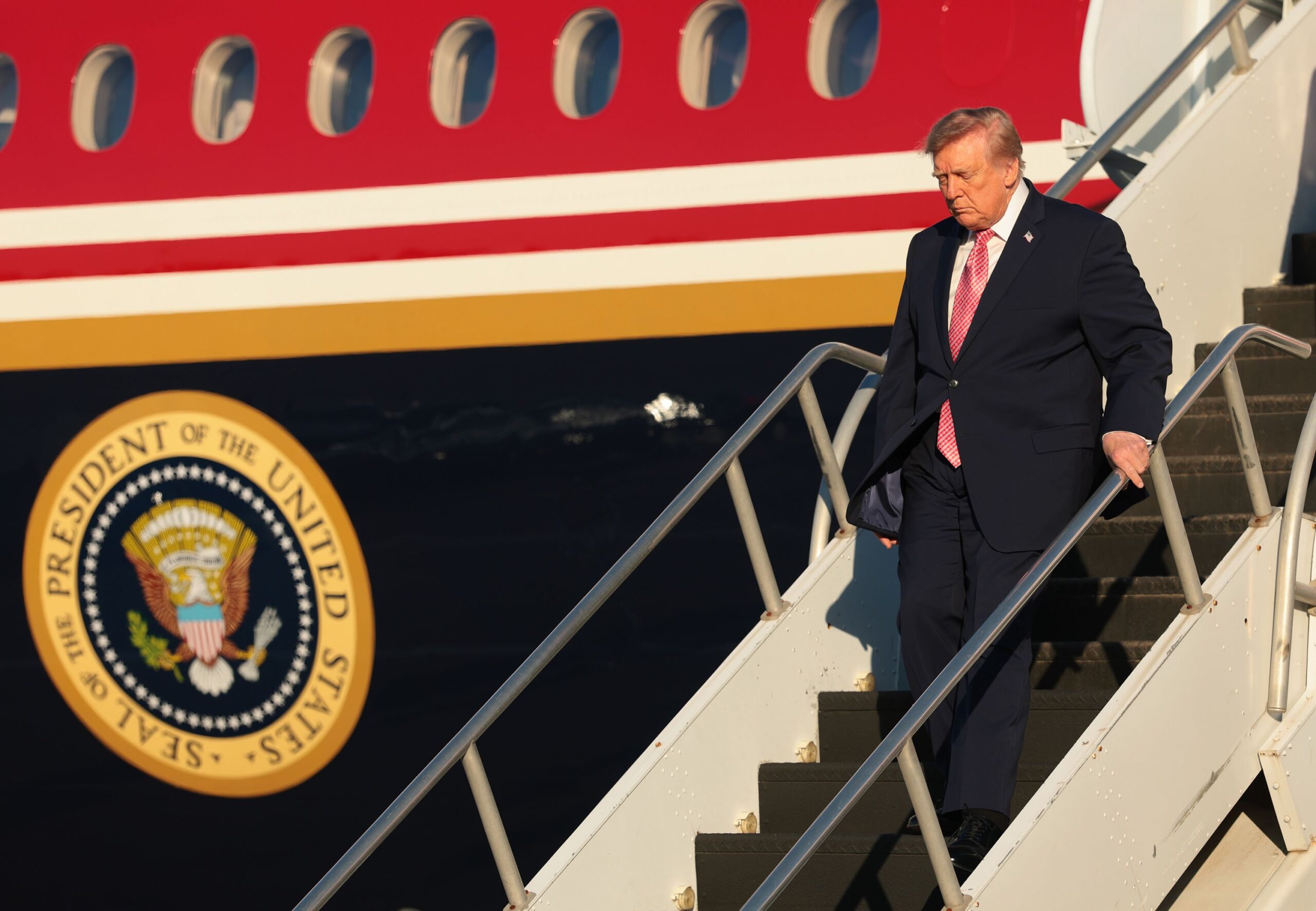 <i>Anna Moneymaker/Getty Images via CNN Newsource</i><br/>President Donald Trump steps off Air Force One at McConnell Air Force Base on October 19