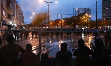 Protesters face police near Porte de Vincennes during a demonstration in favor of purchasing power