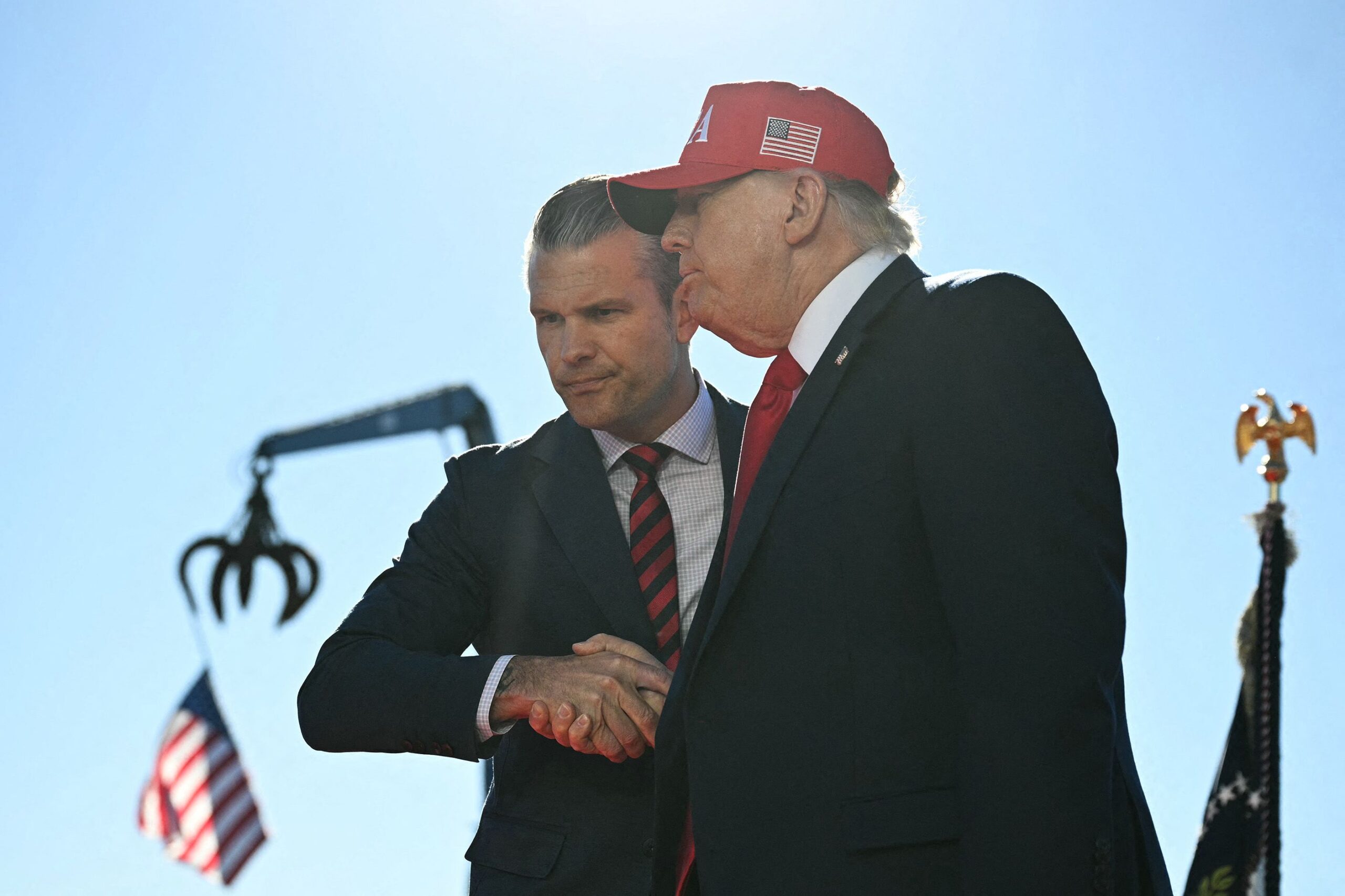 <i>Jim Watson/AFP/Getty Images via CNN Newsource</i><br/>US President Donald Trump shakes hands with Secretary of Defense Pete Hegseth in Sparrows Point