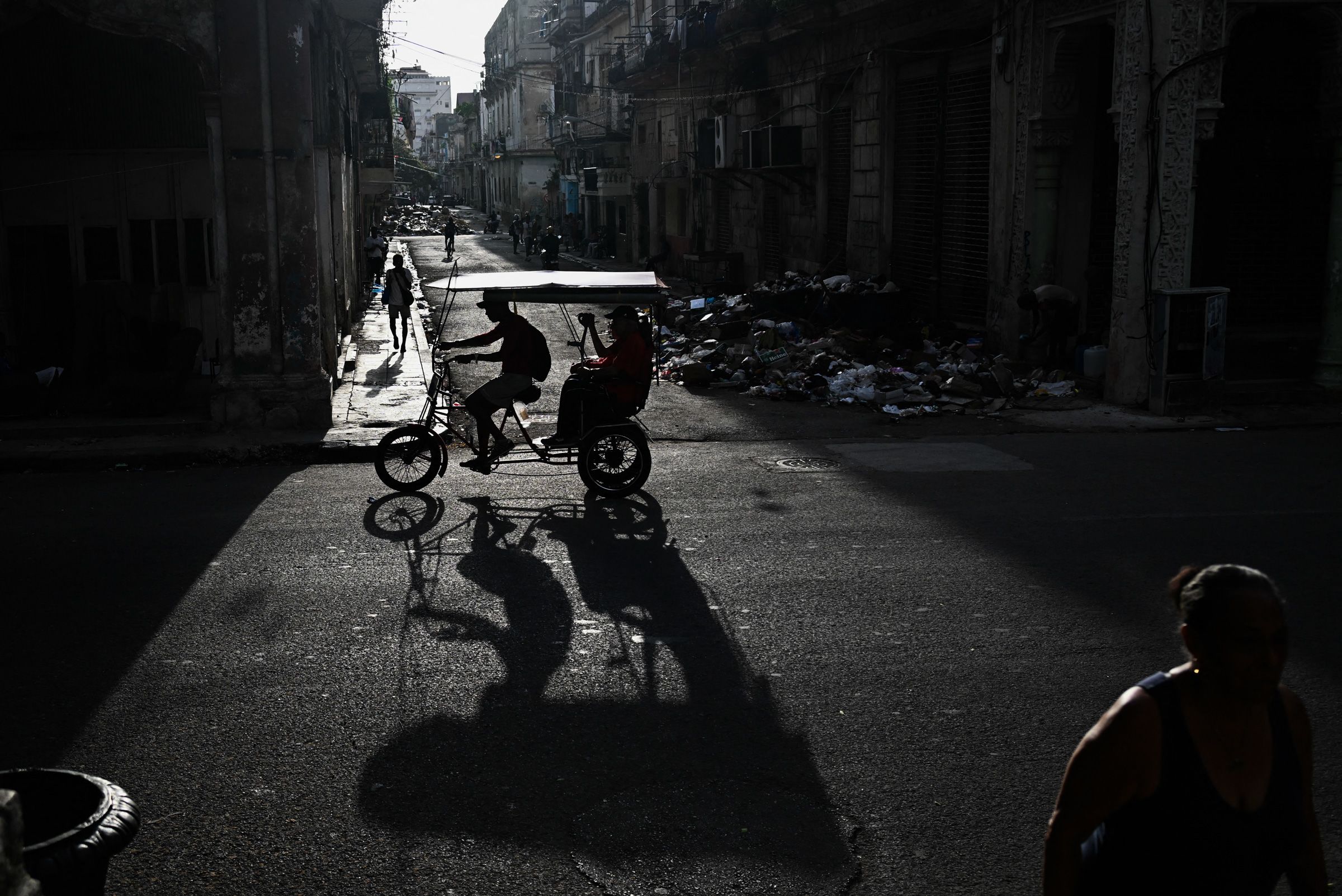 <i>Yamil Lage/AFP/Getty Images via CNN Newsource</i><br/>A car drives down a street in Havana on August 4.
