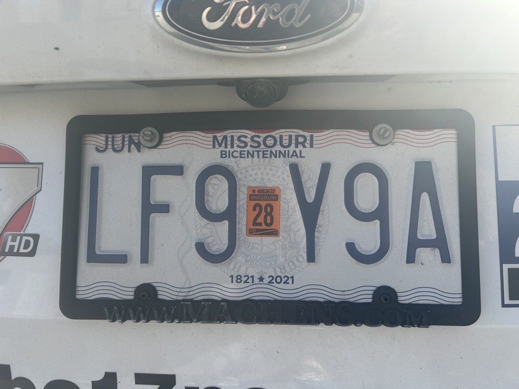 A Missouri license plate with raised letters and numbers in a six-digit pattern. The state will switch to flat plates with seven digits in February 2027.
