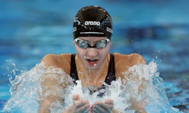 Kate Douglass swims in the pool