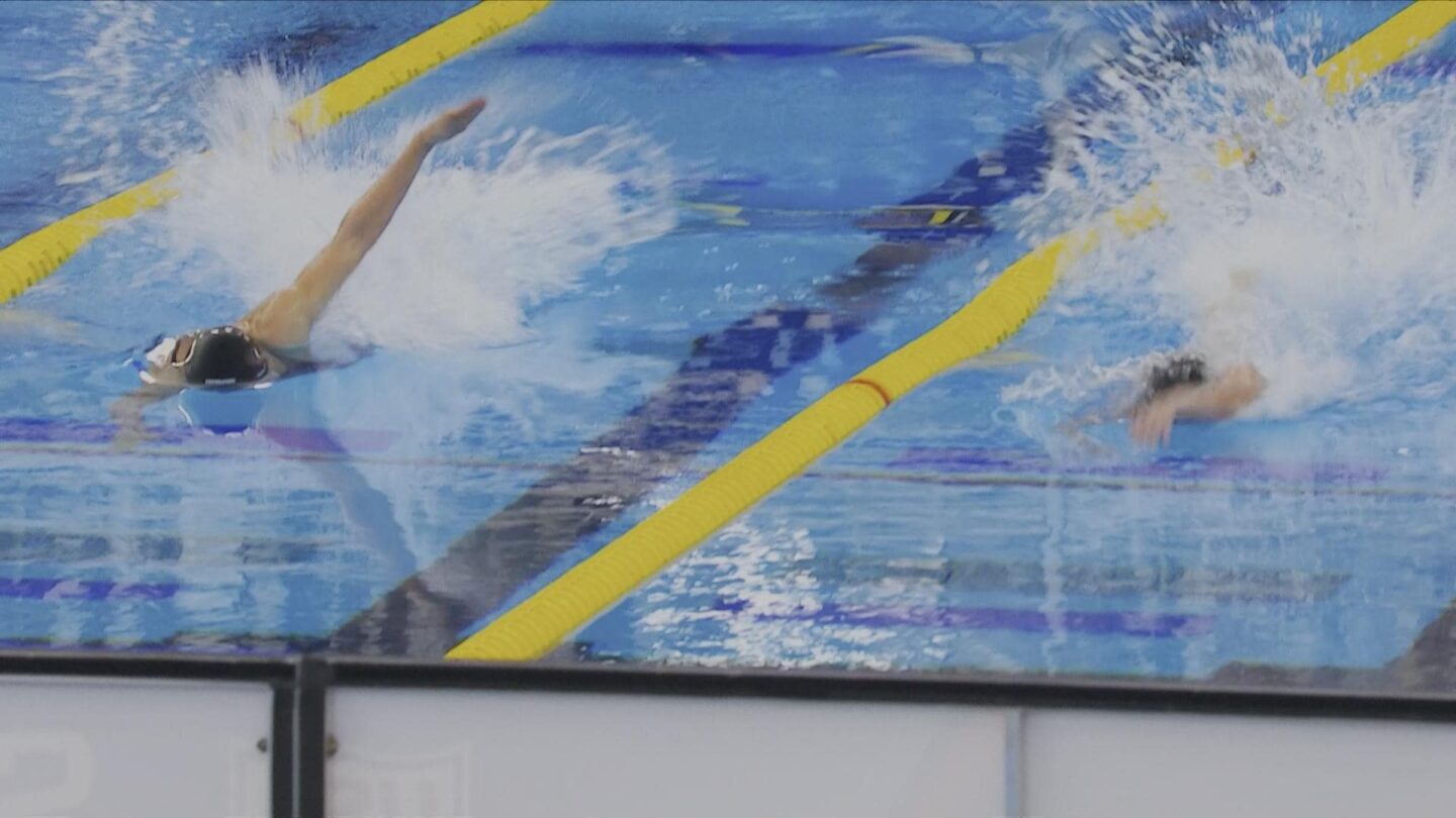 <i>NBC Olympics</i><br/>Two swimmers race side by side